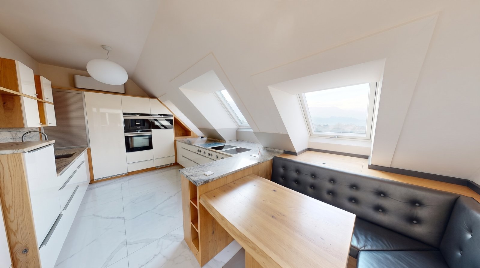 Küche mit Granitarbeitsplatte und Essplatz – Penthouse Wien Donaustadt Küche mit Granitarbeitsplatte und Essplatz – Penthouse Wien Donaustadt